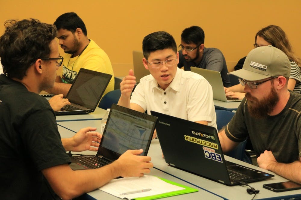 Students discuss important aspects of the pod design during an AZloop Hyperloop team meeting at the Polytechnic campus on Friday, Feb. 10, 2017.