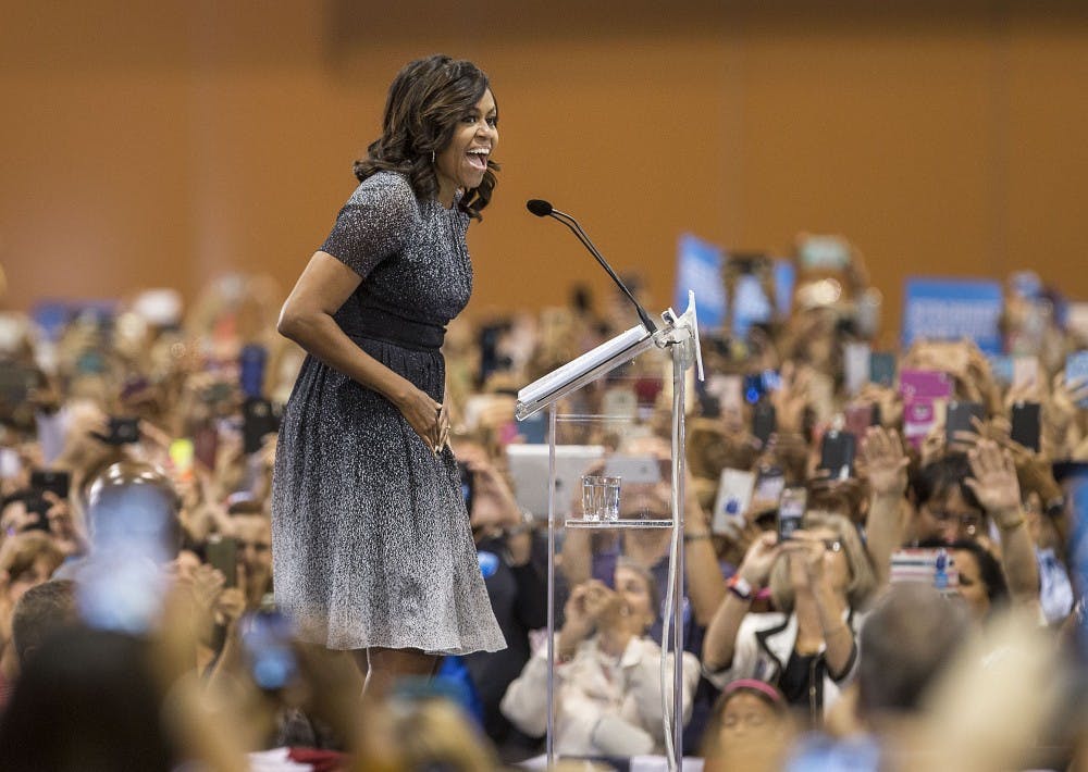 First lady Michelle Obama speaks to a crowd in the Phoenix Convention Center during a campaign stop for Democratic presidential nominee Hillary Clinton on Thursday, Oct. 20, 2016. 