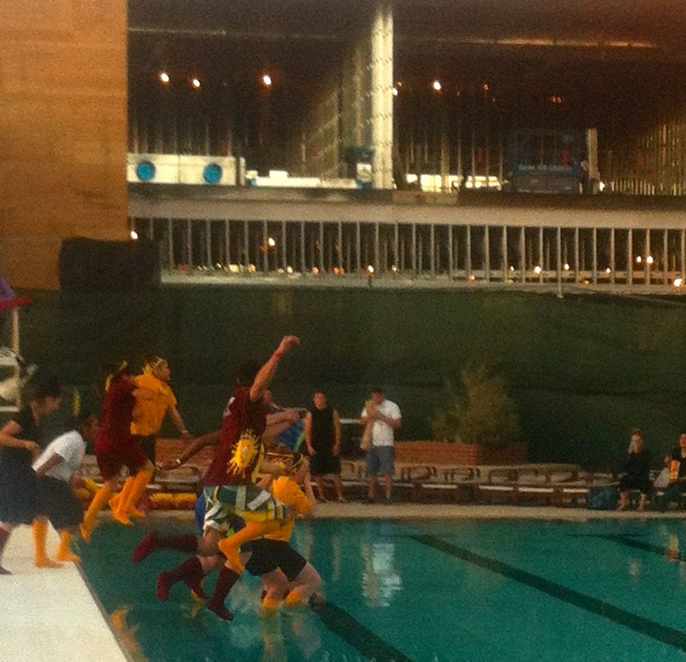 The ladies of Mingus Mountain Academy “plunge” into the pool at the Sun Devil Fitness Complex on March 1, 2013. They won the award for biggest splash and their leader, Allison Dee, raised the most money of any individual competing in ASU Polar Plunge. Photo by Nick Krueger