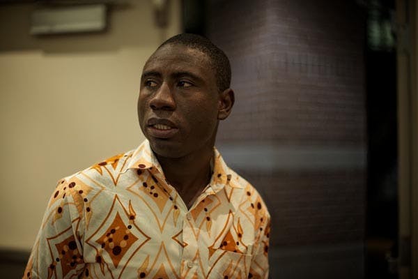 CHILD SLAVE: James Kofi Annan, a former Ghanian child slave, pauses to survey the conference room he gave his presentation in on the West campus, discussing the global slave trade. (Photo by Michael Arellano)