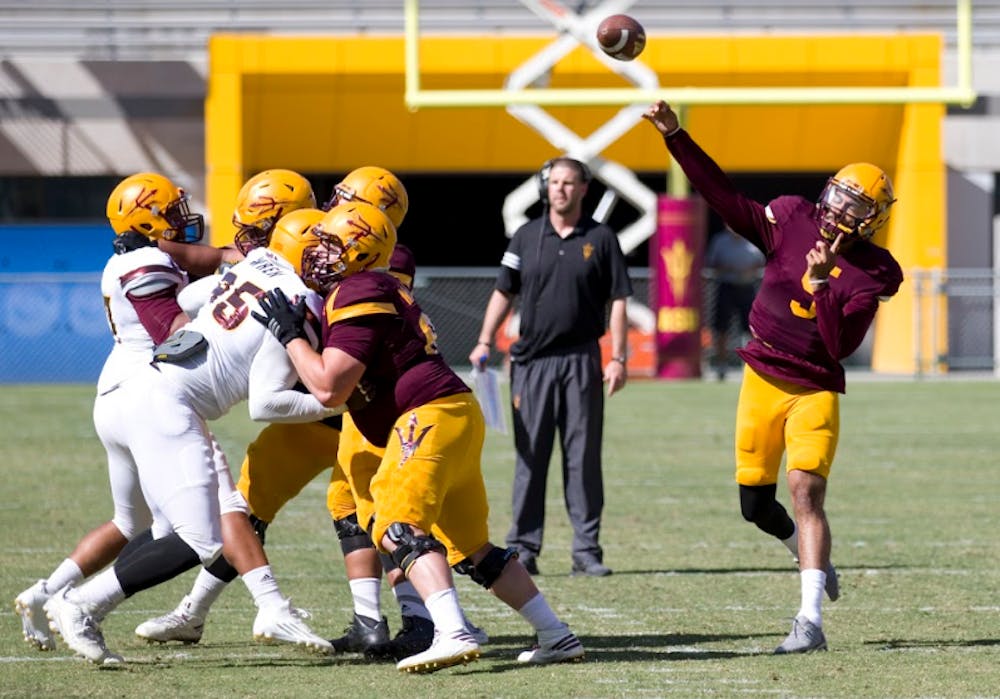 ASU redshirt junior Manny Wilkins (5) throws a touchdown during the annual Spring Football Game in Sun Devil Stadium in Tempe, Arizona on Saturday, April 17, 2017.
