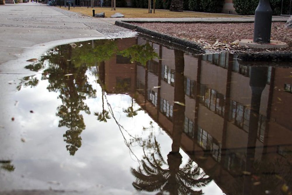 RAINY DAY: A downpour of rain Friday night leaves the Tempe campus covered in reflective puddles Saturday morning. (Photo by Lisa Bartoli)