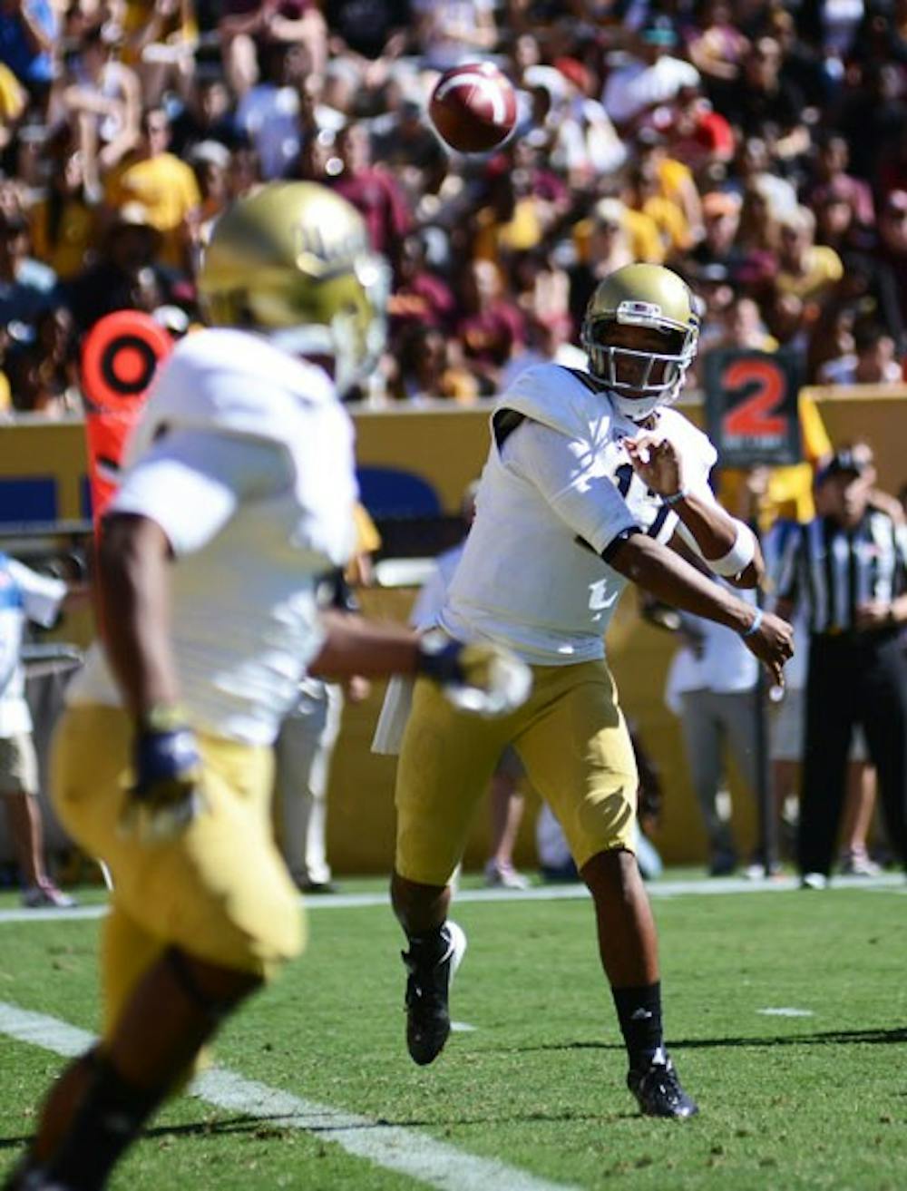 UCLA redshirt freshman quarterback Brett Hundley throws the ball to an open receiver during the Sun Devils' 45-43 loss to the Bruins on Saturday. (Photo by Aaron Lavinsky)