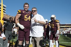 Senior offensive lineman Tyler Sulka poses with Coach Todd Graham before the last home game of the season. ASU beat Washington State 52-31 at Sun Devil Stadium on Saturday, Nov. 22, 2014.  (Photo by Mario Mendez)