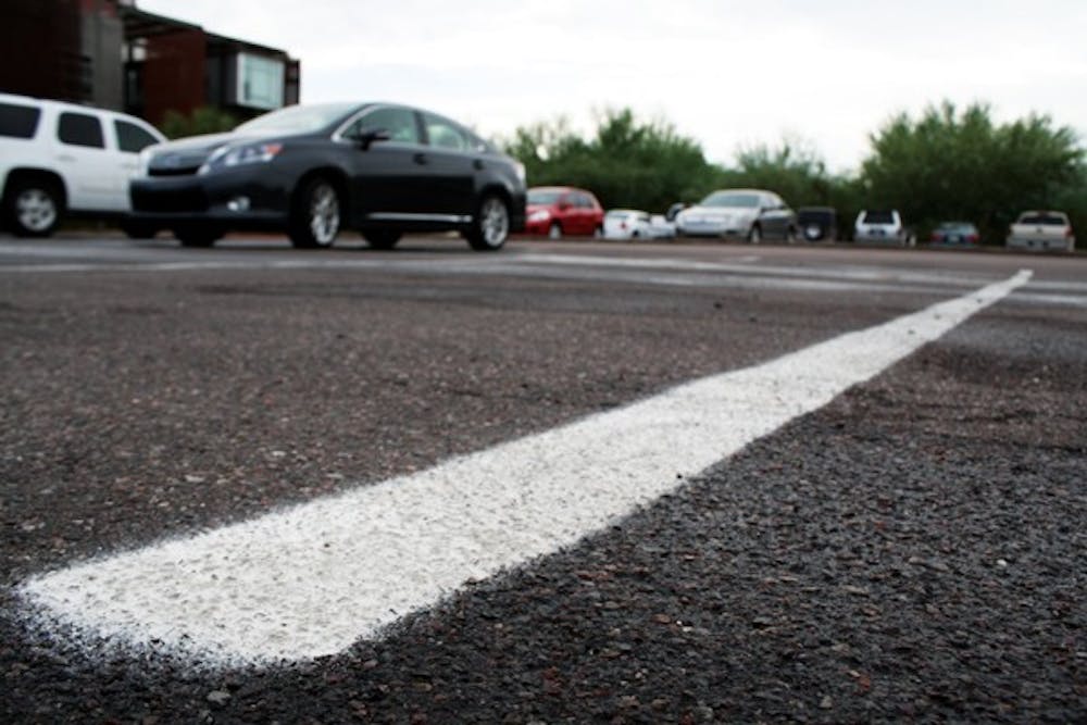 All parking permits at the Polytechnic campus, including green, white and red permits, have undergone a price increase this semester due to rezoning.
(Photo by Jessie Wardarski)