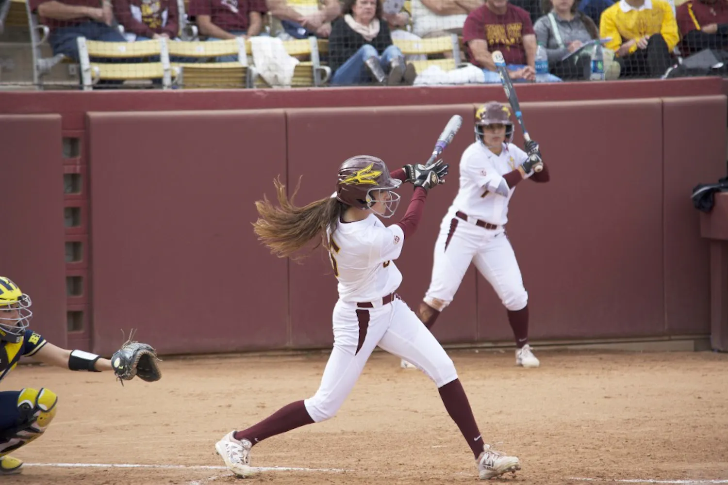 ASU junior Jennifer Soria hits a single against Michigan, Sunday March 1, 2015, at Farrington Stadium in Tempe. The Sun Devils lost to the Wolverines 6-2. (Krista Tillman/The State Press)