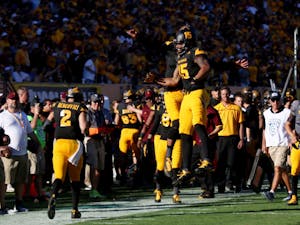 Redshirt senior receiver Devin Lucien celebrates with redshirt freshman quarterback Manny Wilkins after scoring a touchdown in the second half of the Sun Devils' 27-17 win over the Huskies at Sun Devil Stadium on Nov. 14, 2015.