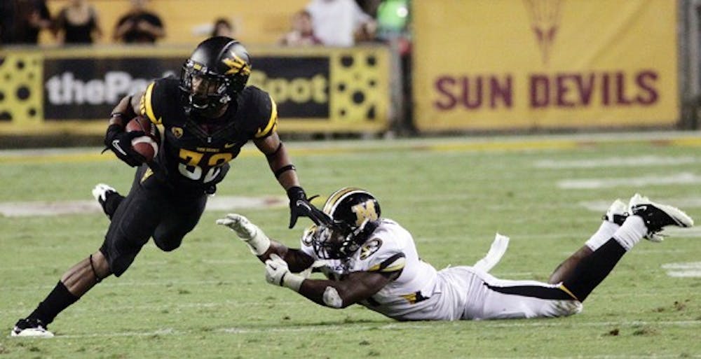 ANOTHER CHALLENGE: ASU junior Jamal Miles dodges a tackle during the Sun Devils’ win over Mizzou on Sept. 9. ASU faces another top-25 team at home when USC visits on Saturday. (Photo by Beth Easterbrook)