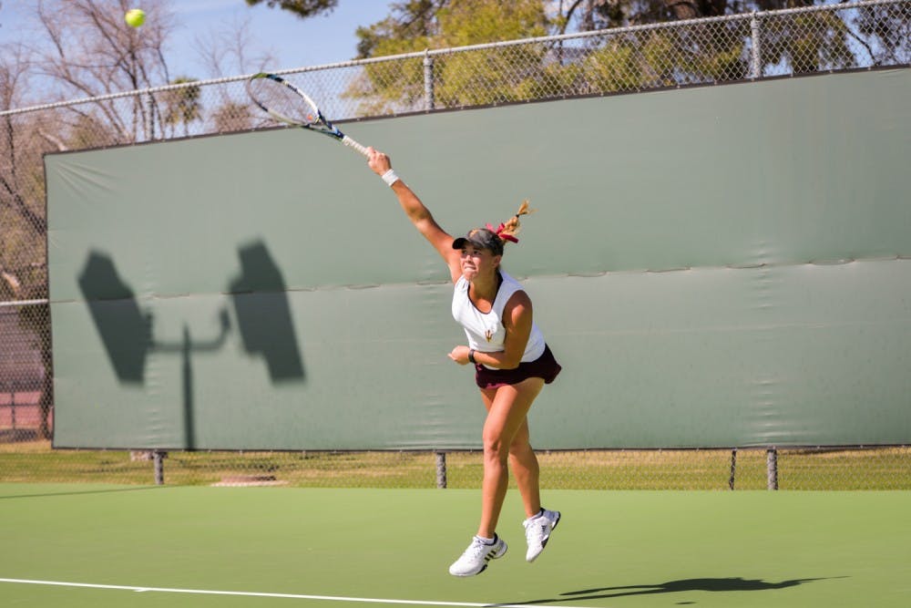 Kassidy Jump serves  the ball during a doubles match-up against the California Bears on  Friday, March 4, 2016, at the Whiteman Tennis Center in Tempe.