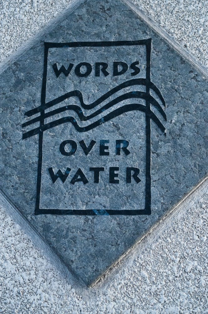 The poetic tiles by Alberto Rios line Tempe Town Lake and continue onto one of the main walking paths surrounding the park. Rios is Arizona's first poet inaugural laureate. (Photo by Katie Dunphy)