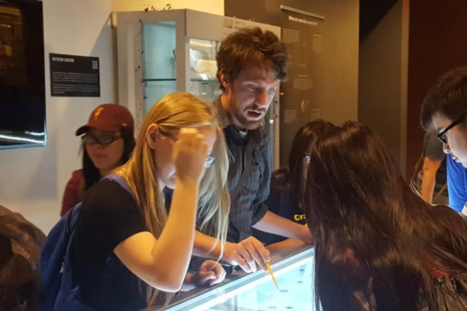Maryvale High School teacher Huntington Keith leads students through the Gallery of Scientific Exploration on Oct. 8, 2016.