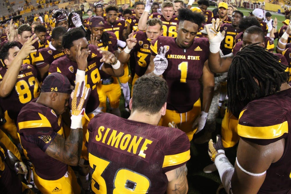 The Sun Devil football team chants the ASU fight song after the game against Cal Poly Saturday, Sept. 12, 2015 at Sun Devil Stadium in Tempe. The Sun Devils defeated the Mustangs 35-21. 