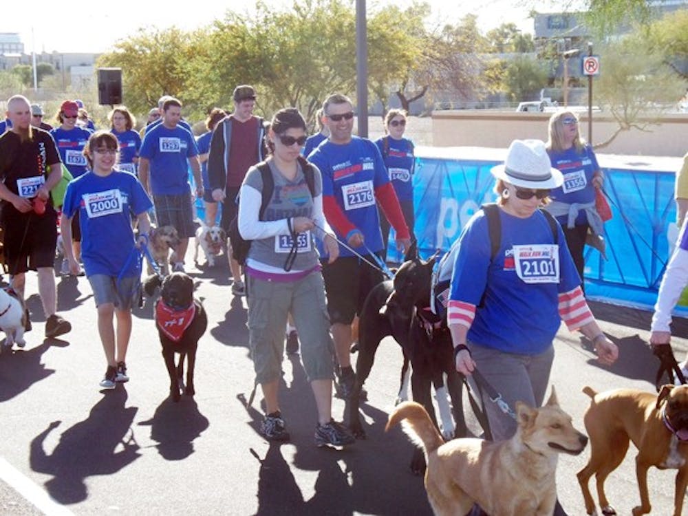 Hundreds of dogs and their owners participated in the first Walk.Run.Wag event on Sunday at the Tempe Arts Park. The event encouraged people and their four-legged friends to become more active together. (Photo by Danielle Grobmeier)