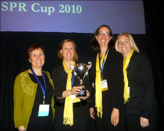 WINNING TEAM: Researchers Monica Parsai, left, Stephanie Ayers, Alex Wagaman and Jennifer Mullins, from the Southwest Interdisciplinary Research Center win an award for their research conducted on bullying intervention. (Photo courtesy of Monica Parsai)
