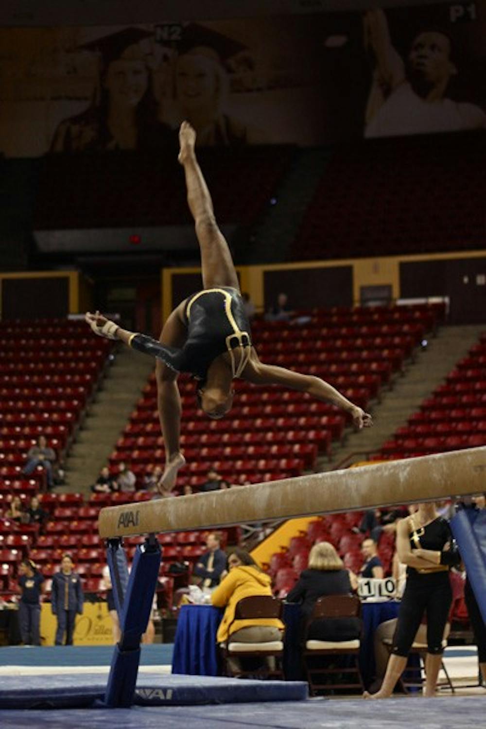 Solid victory: ASU sophomore Nickie Johnson flips on the beam during the Sun Devils’ victory over Cal on Friday night. ASU had strong performances across the board, including on beam, where they had trouble earlier in the season. (Photo by Rosie Gochnour)