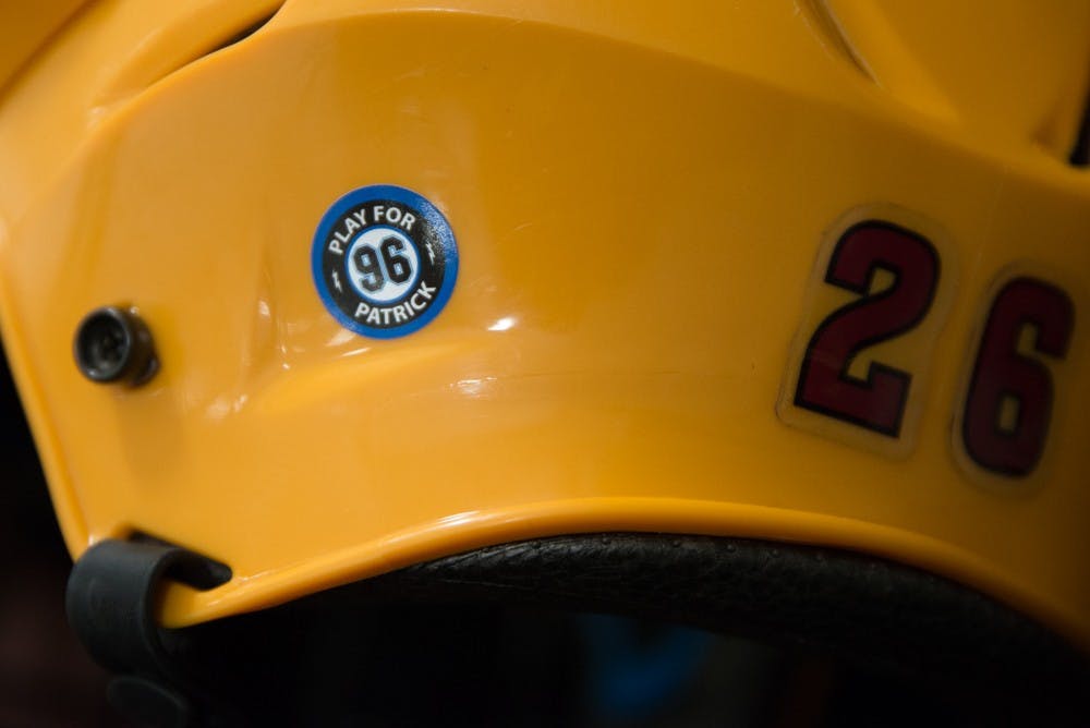 Forward Mak Barden's helmet displays the "Playing for Patrick" sticker as the team remembers him on Thursday Jan. 22, 2015, against the Stony Brook Seawolves at Oceanside Arena in Tempe. (J. Bauer-Leffler/The State Press)