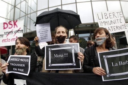 Members of feminist protest group 'La Barbe' (The Beard) held a demonstration in Paris. Photo courtesy of Ian Langsdon. 