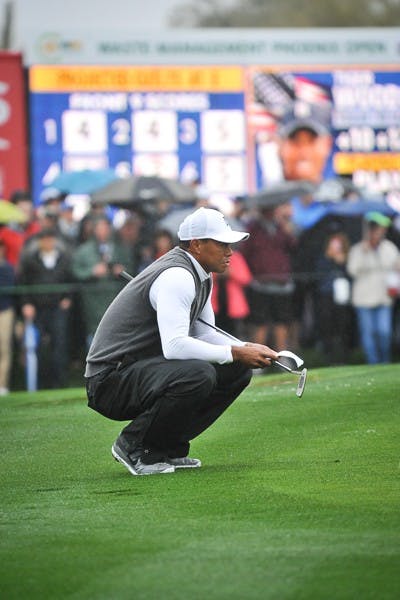 Tiger Woods studies the green at hole 9 at the 2015 Waste Management Phoenix Open on Jan. 30, 2015. (Andrew Ybanez/The State Press)
