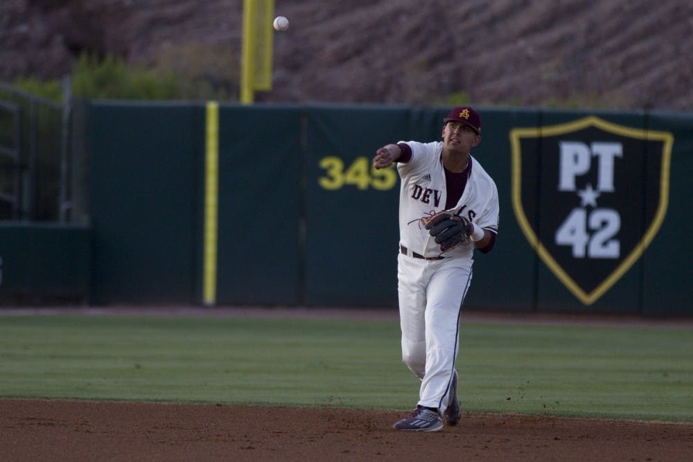 ASU freshman infielder Carter Aldrete (21) throws the ball across the diamond from shortstop to record an out during a baseball game against the UNLV Rebels at Phoenix Municipal Stadium in Phoenix on Tuesday, April 11, 2017. ASU won 5-3.