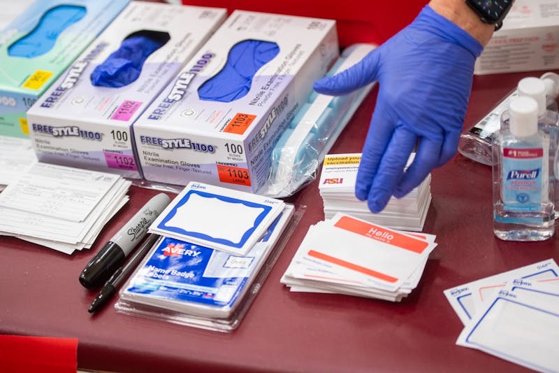 A volunteer worker walks through the COVID-19 vaccine process at the Sun Devils Fitness Complex on the Tempe campus on Tuesday, Feb. 2, 2021.&nbsp;