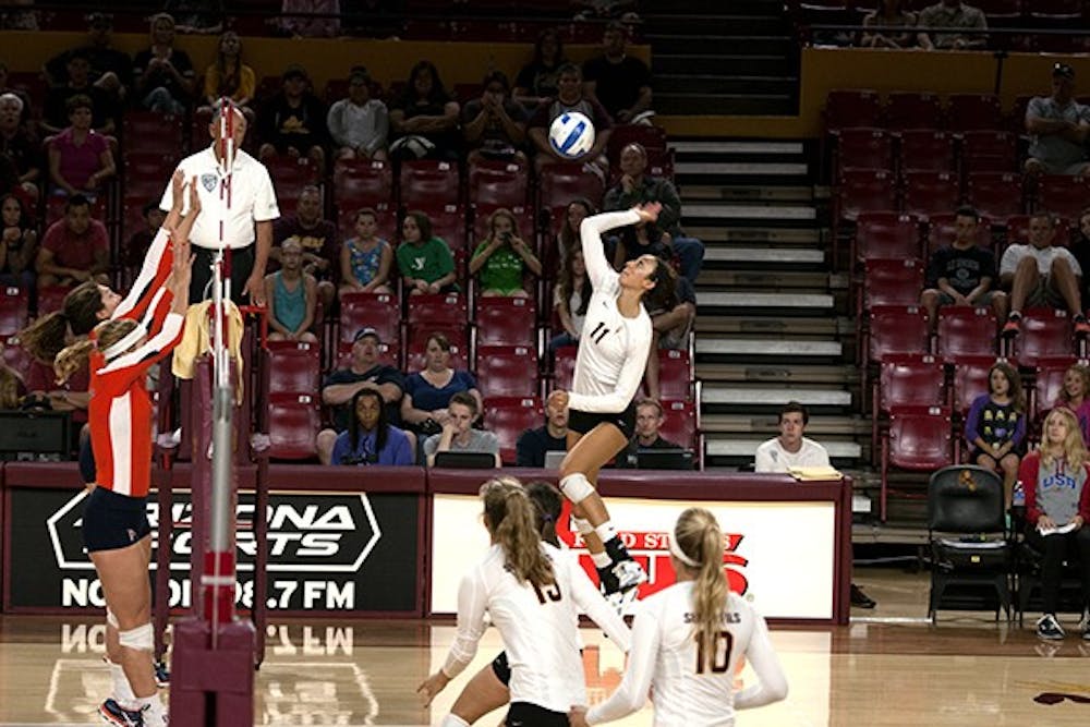 Sophomore outside hitter BreElle Bailey attacks the ball in a match against Pepperdine on Sept. 20, 2014, in Wells Fargo Arena. (Photo by Mario Mendez)