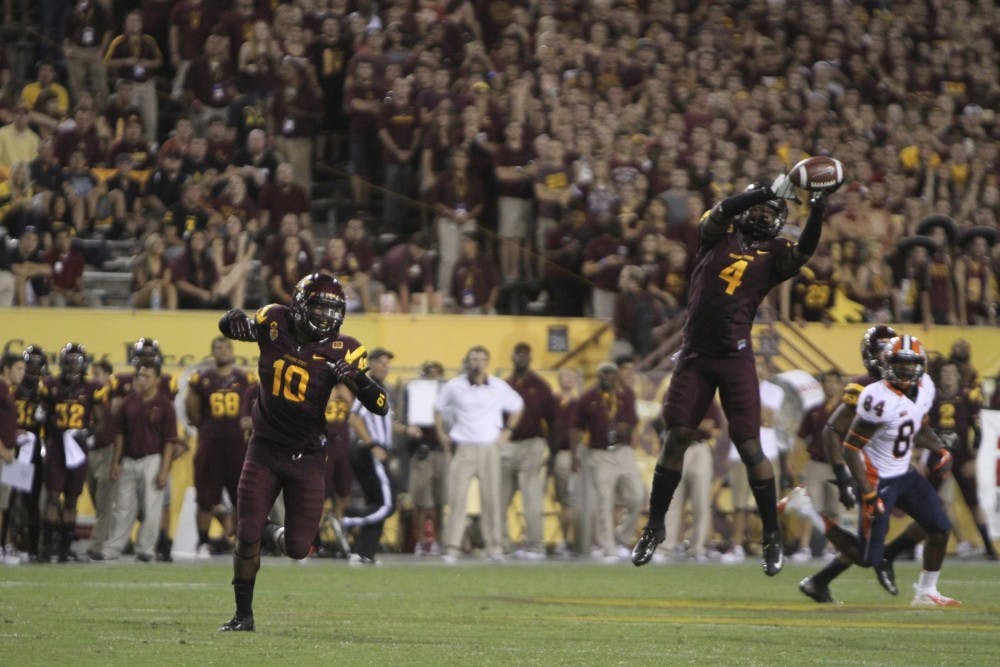 Senior Safety Alden Darby catches an interception against Illinois.