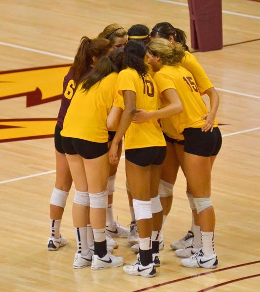 UP IN THE AIR: Junior setter Cat Highmark (7) sets up sophomore middle blocker Sonja Markanovich at a recent practice. The ASU volleyball team opens its season this weekend at the University of Dayton Invitational. (Photo by Andy Jeffreys)