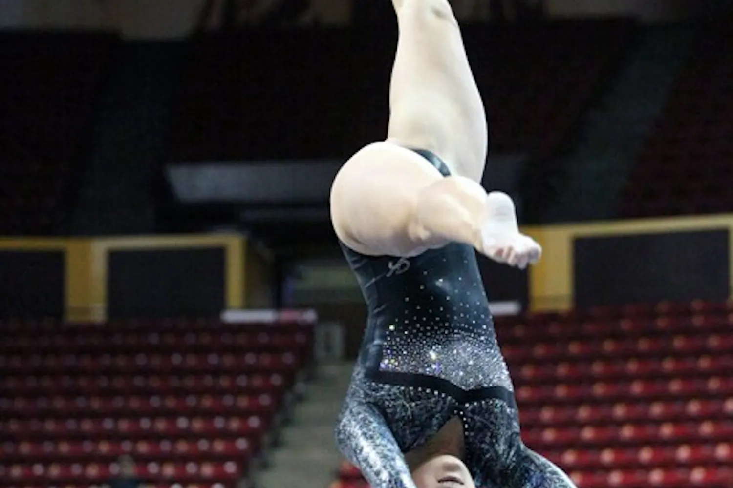 Kahoku Palafox performs a routine on the balance beam in a meet against then-No. 1 Utah on Feb. 12. Palafox was moved into the lineup in the uneven bars and balance beam events after a solid showing against Illinois last weekend. (Photo by Beth Easterbrook)