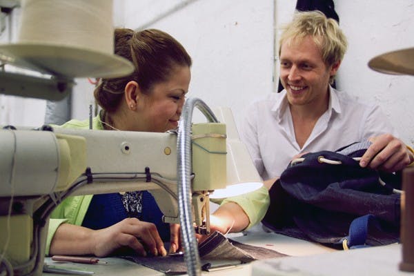 Founder of Benson Backpacks Matthew Clough (right) and an employee work together at the Cut & Sew Shop in Los Angeles, where the backpacks are produced. (Photo courtesy of Sequoia Ziff)