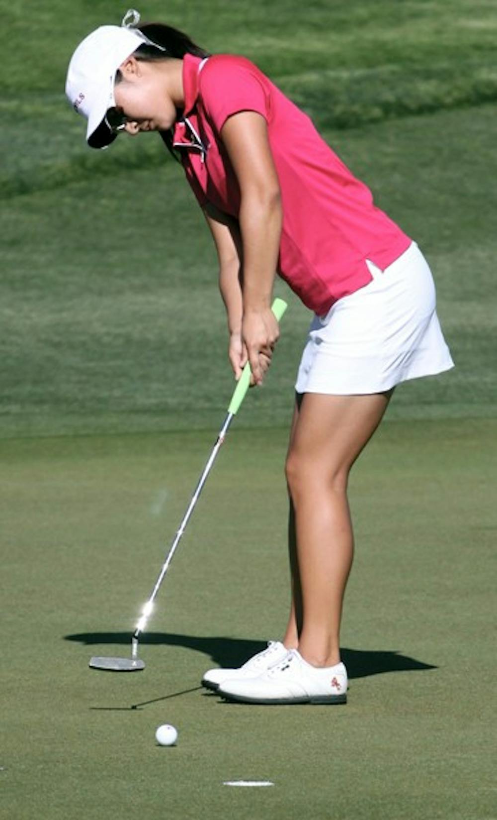 ALMOST THERE: Sophomore Justine Lee attempts a putt during the PING/ASU Invitational at the ASU Karsten Golf Course last April. Lee tied for eighth place in the NCAA Fall Preview over the weekend. (Photo by Beth Easterbrook)