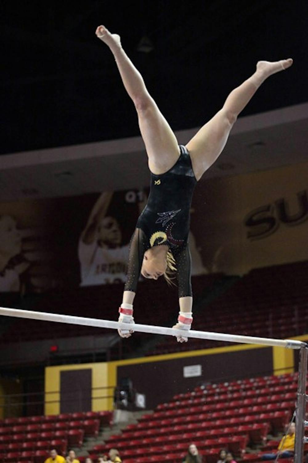 Samantha Seaman performs on the uneven bars in a meet against Cal on Jan. 20. Seaman and the Sun Devils finished their season with a fourth-place finish at the NCAA regionals. (Photo by Beth Easterbrook)