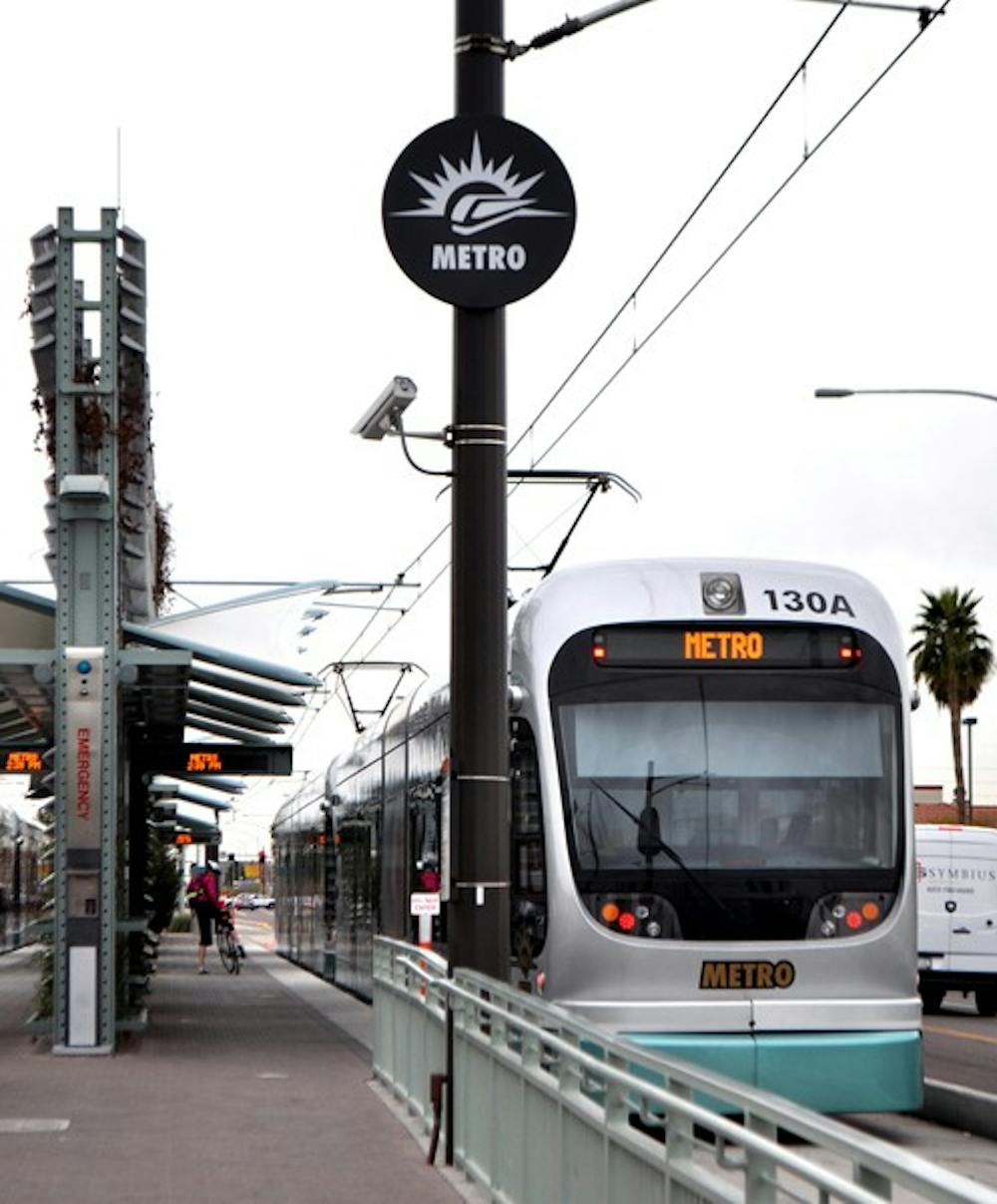 A light rail train arrives at a station in Mesa during its daily route.  City transportation systems now have NextRide Alert, a text system that tells the rider when the next bus or train will be arriving. (Photo by Sierra Smith)