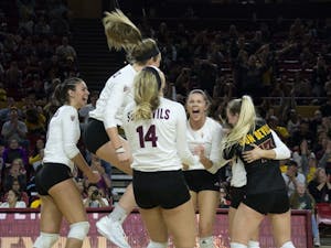 The ASU volleyball team celebrates a win over the UofA in Tempe, AZ, on Nov. 26, 2016.