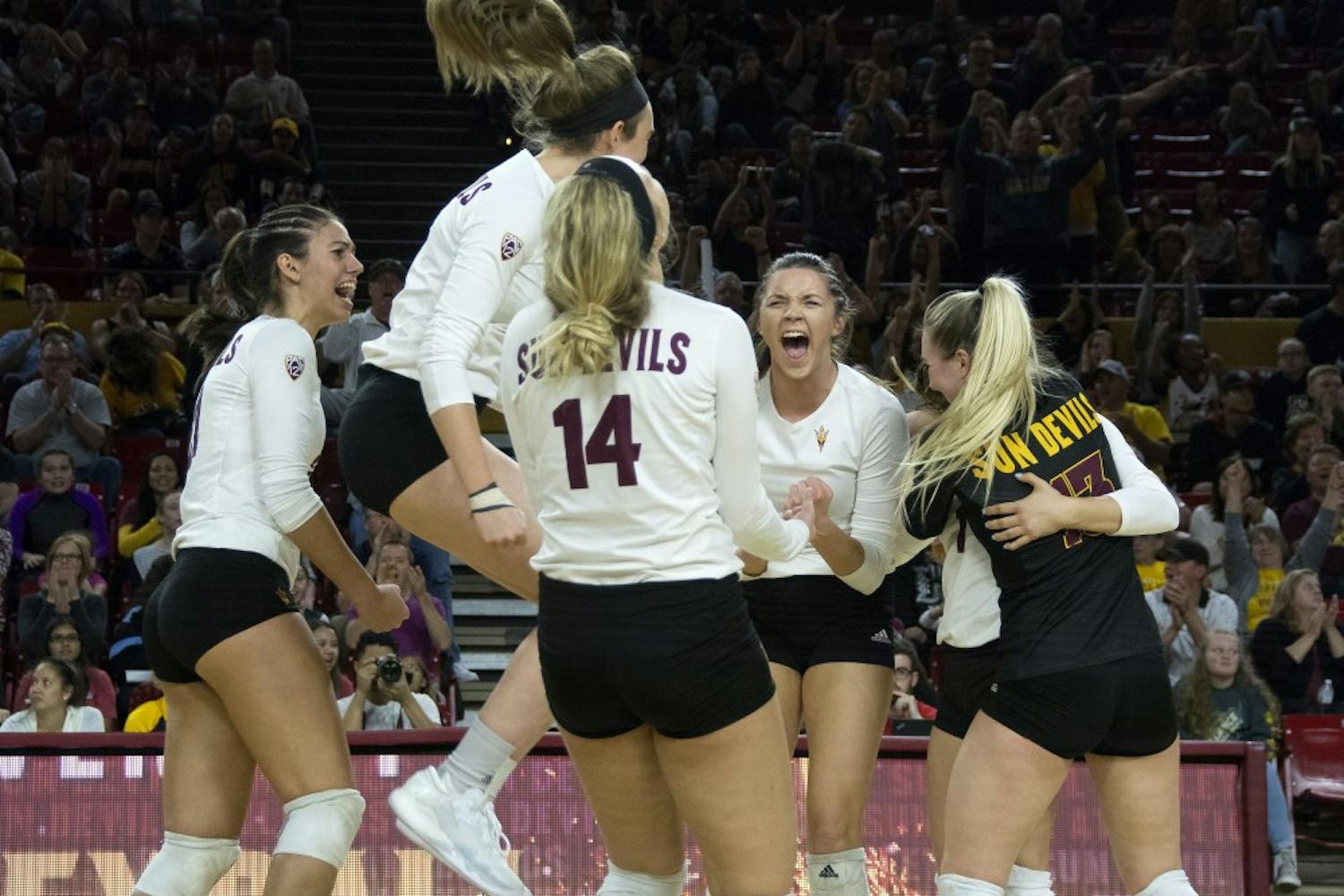 The ASU volleyball team celebrates a win over the UofA in Tempe, AZ, on Nov. 26, 2016.
