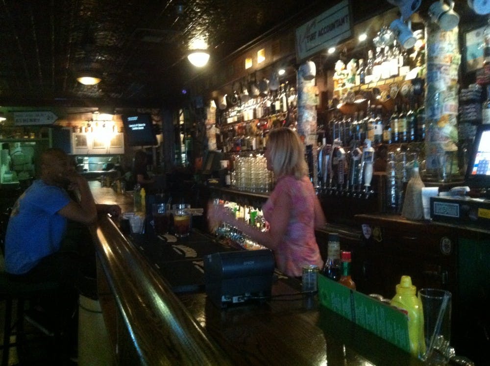 A bartender is pictured serving customers at Seamus McCaffrey's Irish Pub and Restaurant in downtown Phoenix, on Wednesday, April 20, 2016.&nbsp;