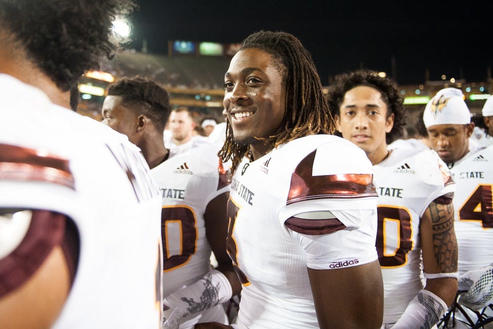 Freshman quarterback Bryce Perkins (3) celebrates on the field after the Sun Devils defeated the New Mexico Lobos 34-10 on Friday, Sept. 18, 2015, at Sun Devil Stadium in Tempe.