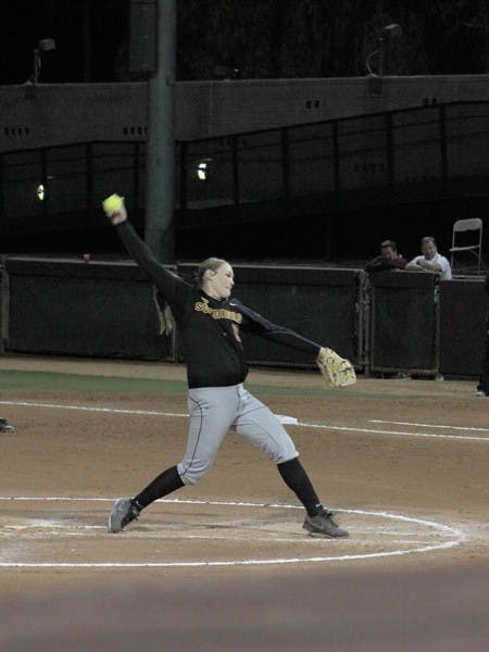 Junior pitcher Dallas Escobedo lands on her left leg before firing a pitch against North Carolina on March 2. Escobedo has given up 14 home runs this season. (Photo by Abhiram Chandrash) 