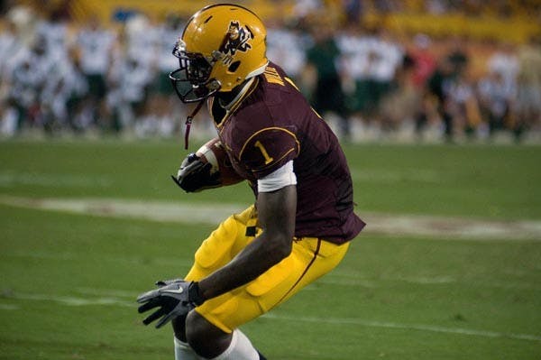 GAME CHANGER: Junior wide receiver Mike Willie looks for a route after catching a pass against Oregon earlier this season. ASU topped Washington with a last-second touchdown last year, but travel to Seattle on Saturday to take on the Huskies. (Photo by Aaron Lavinsky)