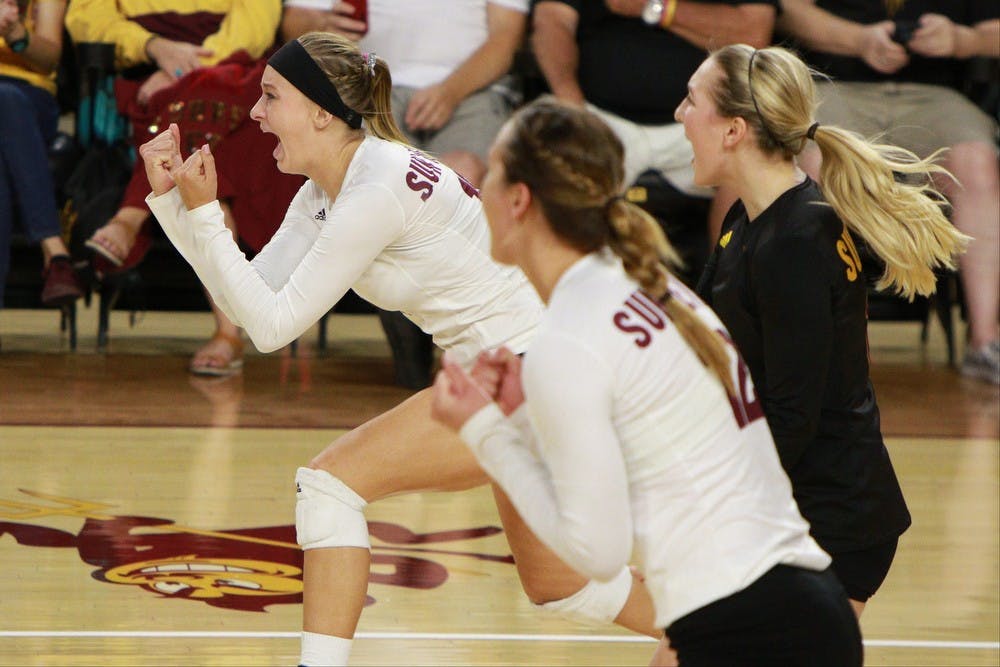 Junior outside hitter Kizzy Ricedorff, left, reacts after winning a point in the second set against Oregon State Sunday, Sept. 27, 2015 at Wells Fargo Arena in Tempe. The Sun Devils defeated the Beavers three games to none to improve to 13-0 on the season (25-18, 25-19, 25-20).