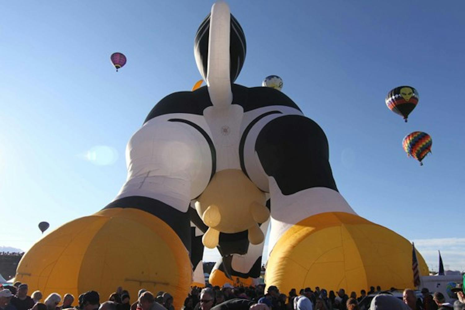 COW BUM: Arabelle the Creamland Cow towers over the crowd at the Albuquerque International Ballon Fiesta in New Mexico on Saturday.  Arabelle is one of the largest special shape balloons at eighty feet tall and 120 feet long. (Photo by Lisa Bartoli)