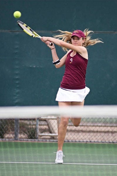 FINISHING STRONG: ASU junior Micaela Hein delivers a backhanded shot during the Sun Devils' 6-1 win over Fresno State in February. ASU closed out the regular season with a 5-2 win over UA in Tucson on Saturday. (Photo by Micahel Arellano)