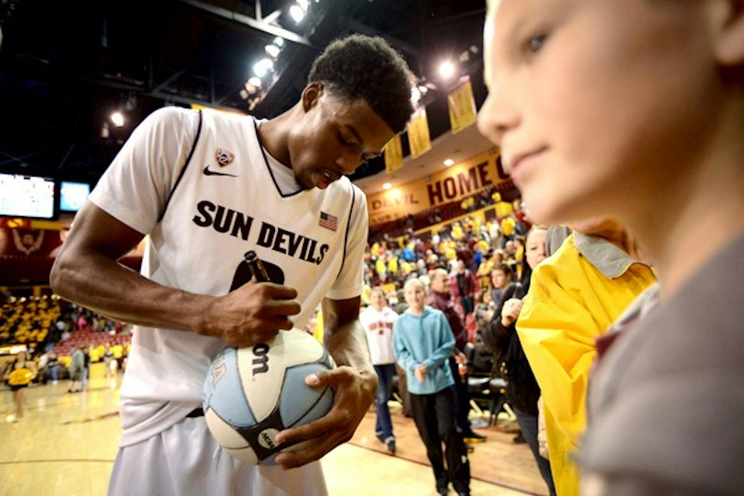 Senior wing Carrick Felix signs a basketball for fans after the January 2nd game against Utah. On Monday, Felix was announced Pac-12 Player of the Week. This is the 32nd all-time selection for the Sun Devils, and Felix is the only player to receive the award twice this season. (Photo Courtesy of Aaron Lavinsky)
