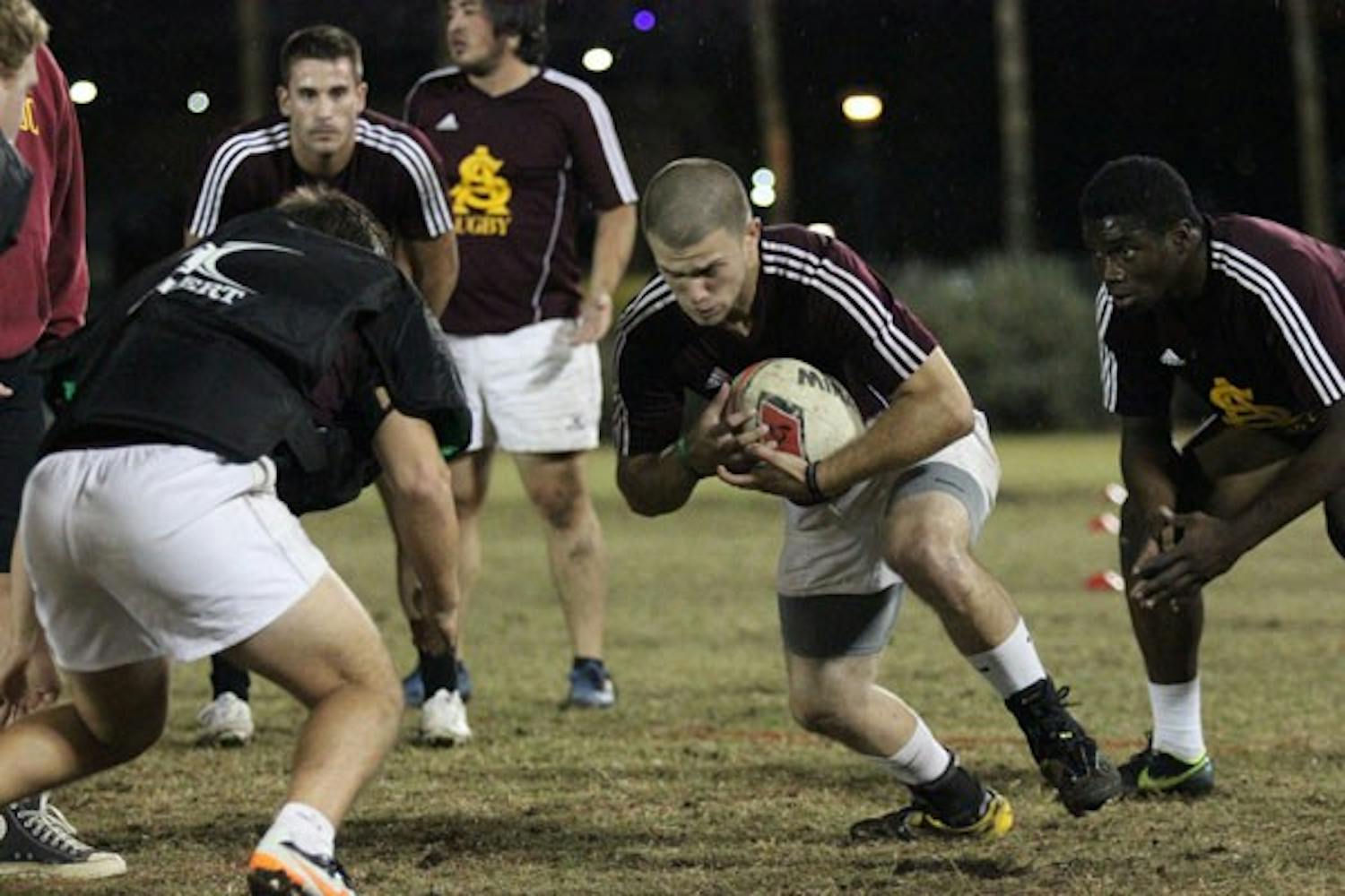 Health solutions junior Thomas Boyle practices at an ASU rugby practice on the Sun Devil Fitness Complex fields on Nov. 8. (Photo by Kyle Newman)