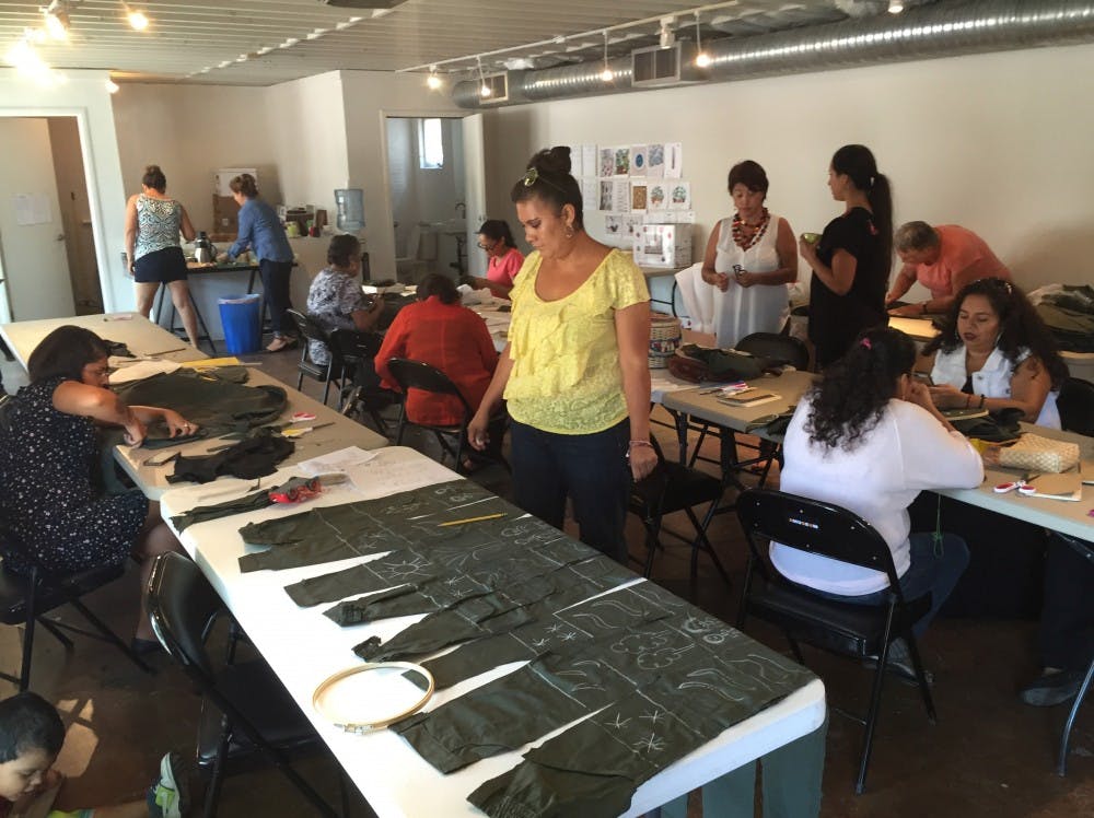 Participants at a workshop create sculptures for the exhibit "Space in Between."