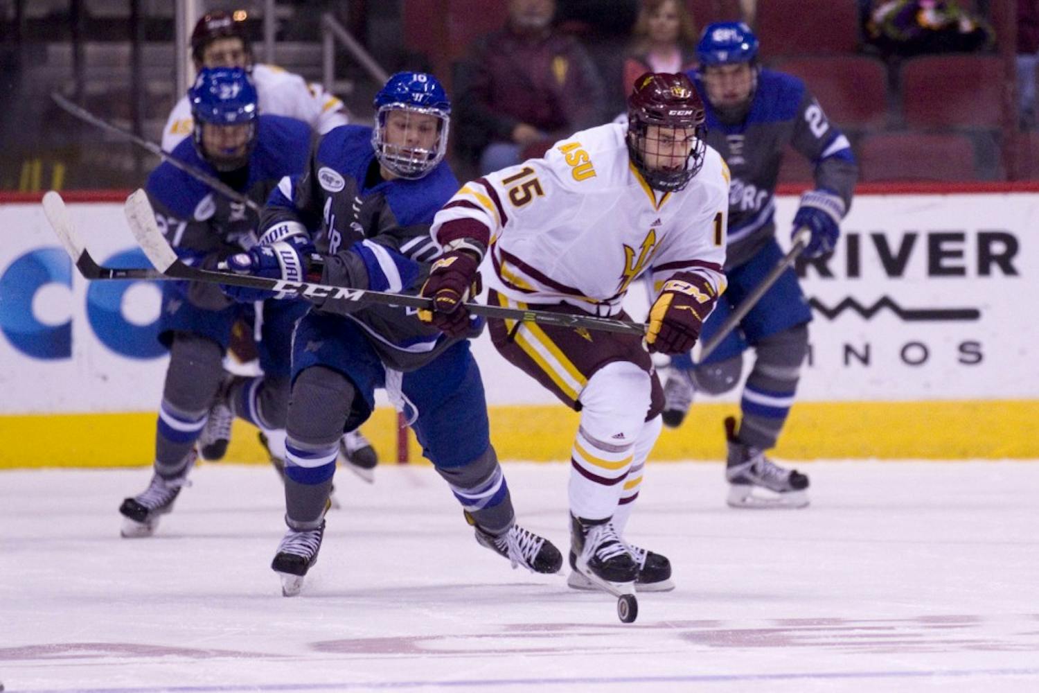 ASU junior right winger Wade Murphy (15) skates down the puck in the first period of a 4-3 loss to the Air Force Academy in Gila River Arena in Glendale, Arizona, on Friday, Oct. 14, 2016.