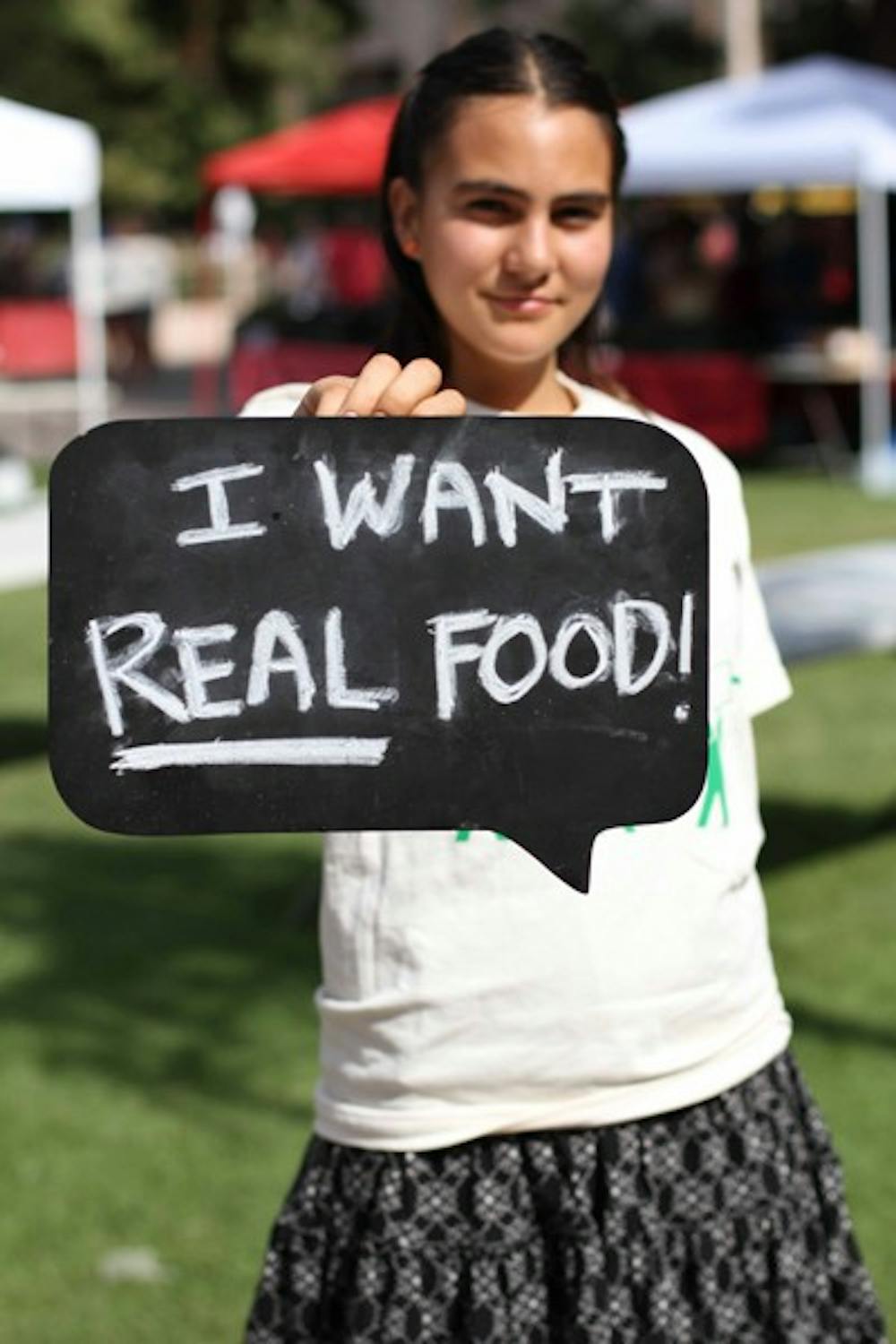 FOOD CRITICS: Volunteer Nicole Maria helped with the Real Food Challenge on the Tempe campus Tuesday.  The group is petitioning campus food providers to offer healthier and more diverse food choices. (Photo by Lisa Bartoli)