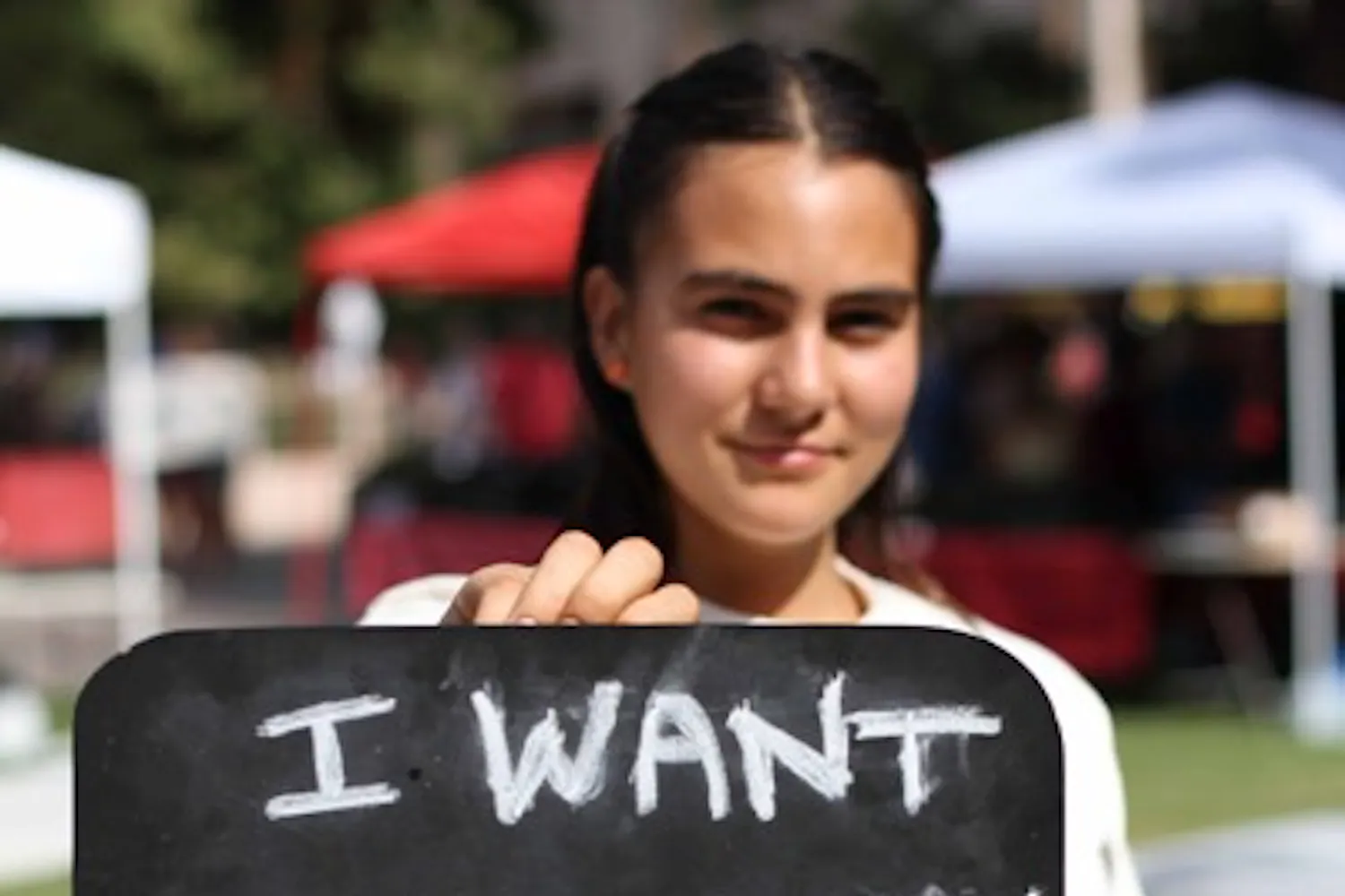 FOOD CRITICS: Volunteer Nicole Maria helped with the Real Food Challenge on the Tempe campus Tuesday. The group is petitioning campus food providers to offer healthier and more diverse food choices. (Photo by Lisa Bartoli)
