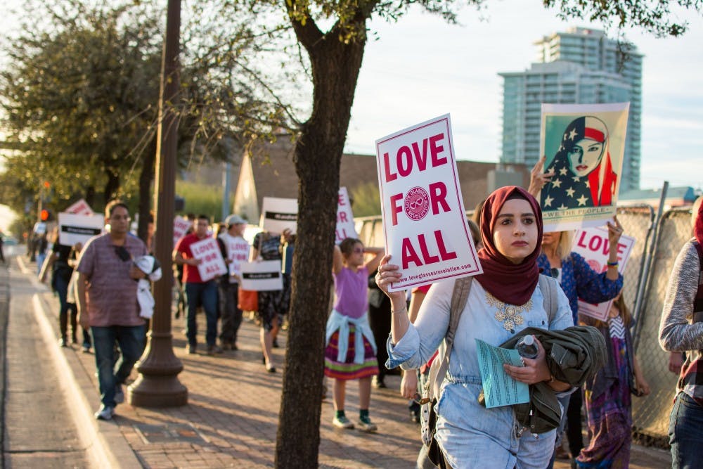 Protesters gather for a silent march in Tempe