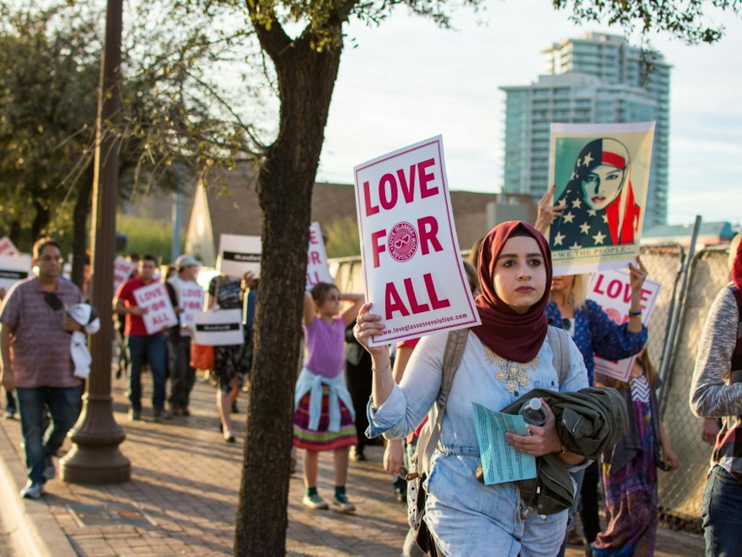 Protesters gather for a silent march in Tempe