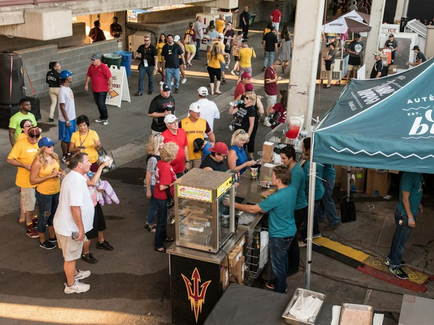 A crowd lines-up for restaurant Someburros’ new location on the east side concourse of Sun Devil Stadium before a game against Texas Tech on Saturday, Sept. 10, 2016.